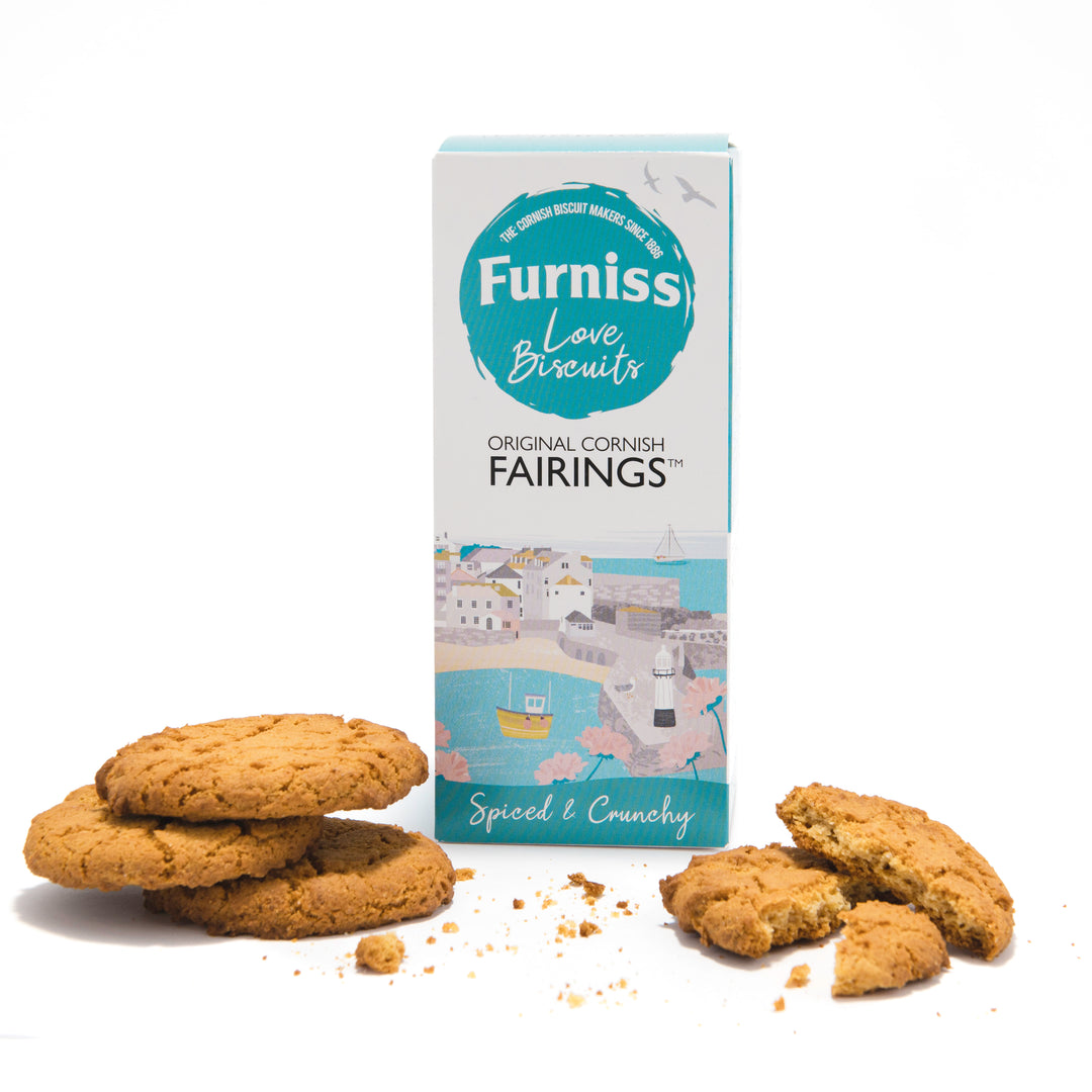 box of furniss cornish fairings with biscuits scattered on white background. 