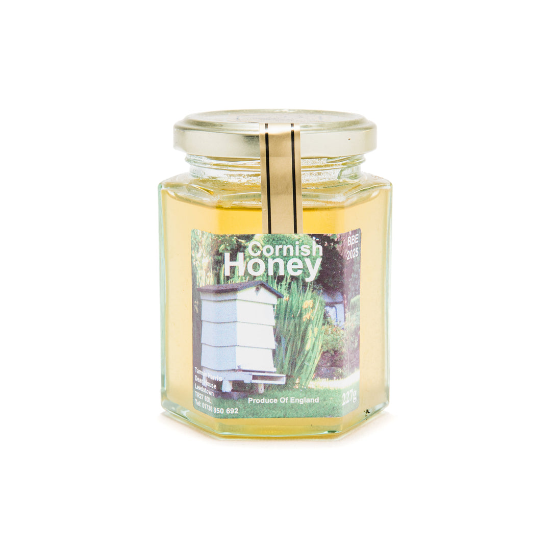 Jar of cornish honey on a white background.