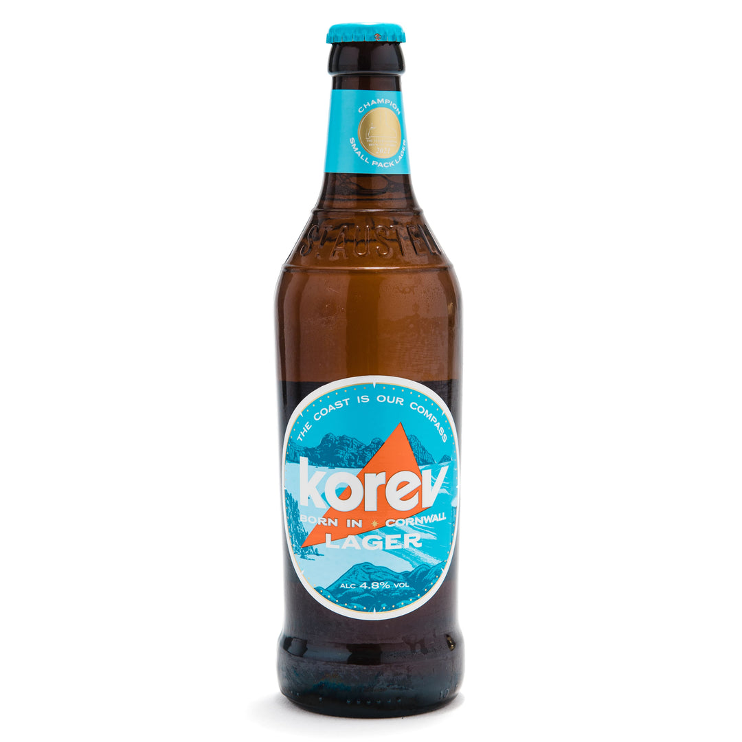 bottle of korev lager on a white background.