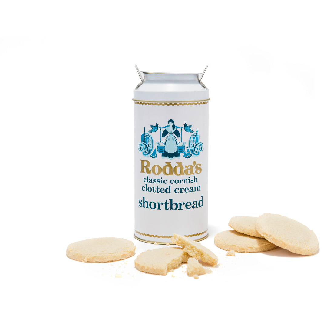 tub of roddas shortbread with biscuits scattered on the white background.
